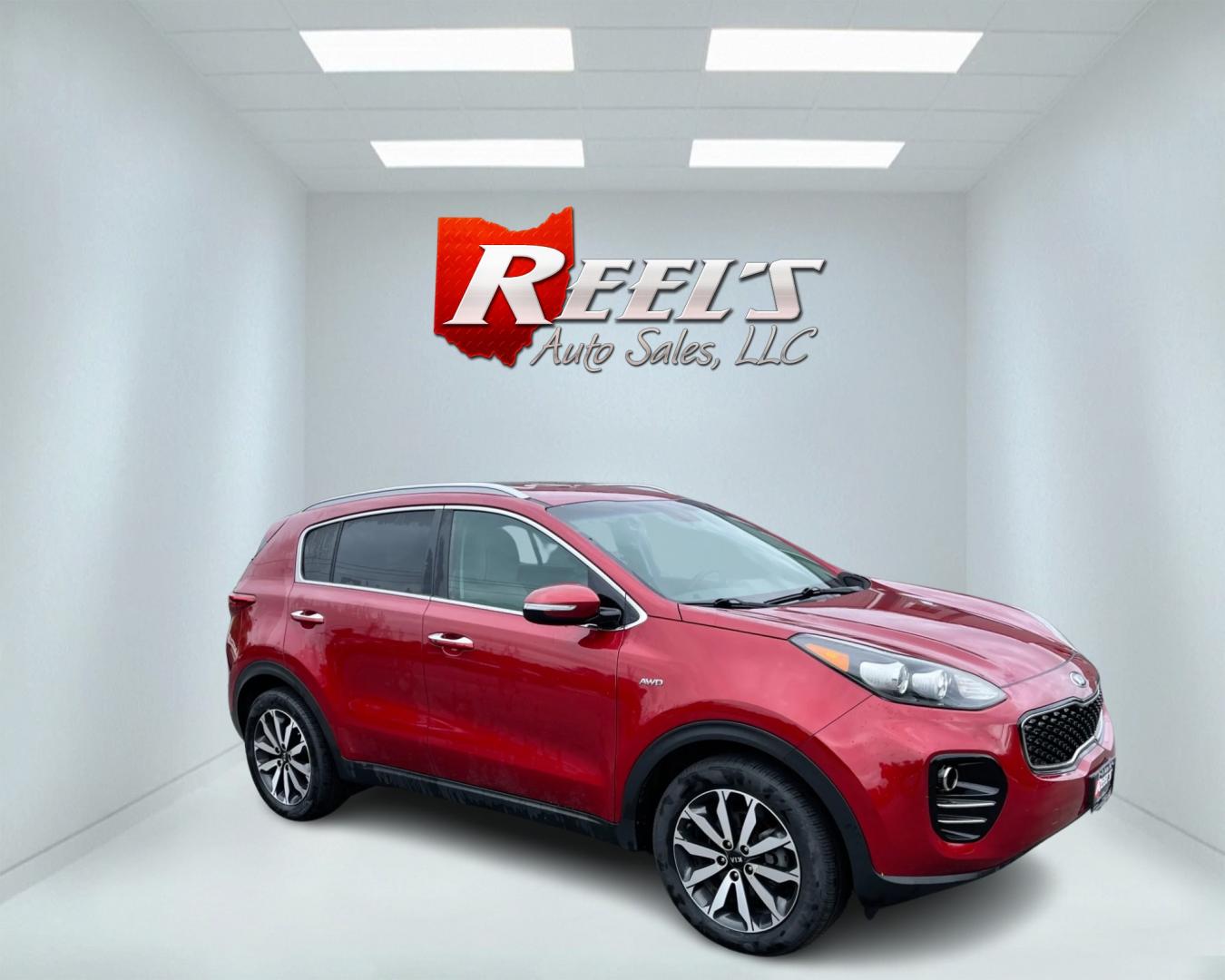 2018 Red /Gray Kia Sportage EX AWD (KNDPNCAC3J7) with an 2.4L I4 DOHC 24V engine, 6A transmission, located at 547 E. Main St., Orwell, OH, 44076, (440) 437-5893, 41.535435, -80.847855 - This 2018 Kia Sportage EX AWD is a well-rounded compact SUV that offers a good blend of capability and features. It comes equipped with a 2.4L I4 GDI engine paired with a 6-speed automatic transmission and AWD system with locking center differential. The driving experience is enhanced by features li - Photo#3